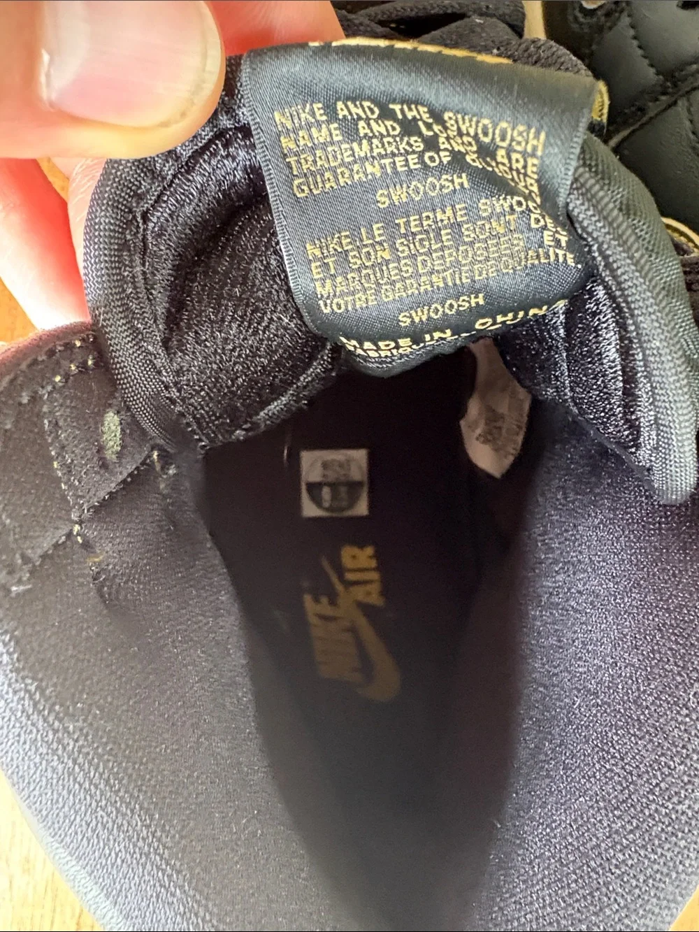 Air Jordan High-Top Sneakers in Black and Gold